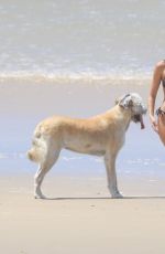 GABRIELLA BROOKS in Bikini and Liam Hemsworth at a Beach in Byron Bay 02/24/2021