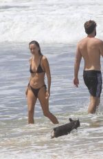 GABRIELLA BROOKS in Bikini and Liam Hemsworth at a Beach in Byron Bay 02/24/2021