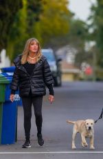 GOLDIE HAWN and Kurt Russell Out with Their Dog in Brentwood 02/15/2021