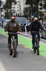 HEATHER MILLIGAN and Arnold Schwarzenegger Out Riding Bikes in Santa Monica 02/13/2021