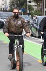 HEATHER MILLIGAN and Arnold Schwarzenegger Out Riding Bikes in Santa Monica 02/13/2021