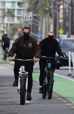 HEATHER MILLIGAN and Arnold Schwarzenegger Out Riding Bikes in Santa Monica 02/13/2021