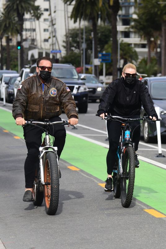 HEATHER MILLIGAN and Arnold Schwarzenegger Out Riding Bikes in Santa Monica 02/13/2021