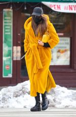 IRINA SHAYK in a Long Yellow Coat Out in New York 02/12/2021