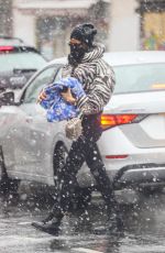 IRINA SHAYK in a Zebra Puffer Jacket on a Snowy Day in New York 02/22/2021