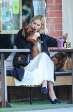 KELLY RUTHERFORD Out with her Dogs at Kreation Organic in Beverly Hills 02/18/2021