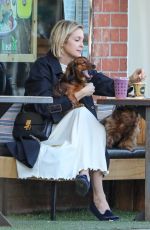 KELLY RUTHERFORD Out with her Dogs at Kreation Organic in Beverly Hills 02/18/2021