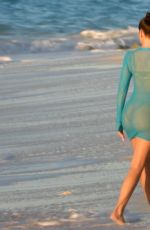 KHLOE KARDASHIAN at a Photoshoot on the Beach in Turks and Caicos 01/28/2021