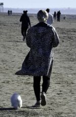LUCY FALON Out with Her Dog on Blackpool Beach 02/22/2021