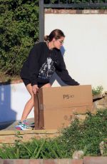 LUCY HALE Collects Some Packages Outside Her Home in Los Angeles 02/24/2021