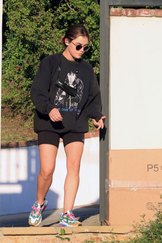 LUCY HALE Collects Some Packages Outside Her Home in Los Angeles 02/24/2021