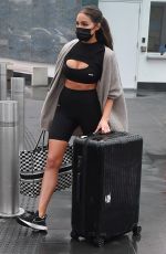 OLIVIA CULPO in Tights Rolls Her Luggage Out in Miami 02/06/2021