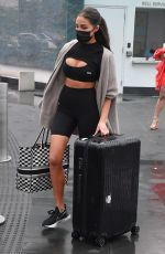 OLIVIA CULPO in Tights Rolls Her Luggage Out in Miami 02/06/2021