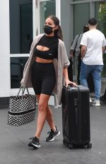 OLIVIA CULPO in Tights Rolls Her Luggage Out in Miami 02/06/2021