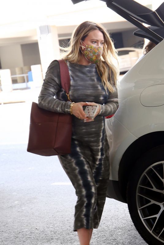 Pregnant HILARY DUFF Arrives in Los Angeles 02/12/2021