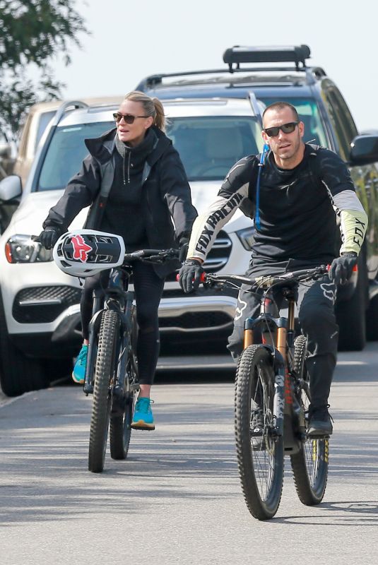 ROBIN WRIGHT and Clement Giraudet Out Riding Bikes in Los Angeles 02/11/2021