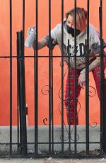 TINA LOUISE Painting a Fence Outside Her Restaurant in West Hollywood 02/01/2021