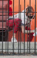 TINA LOUISE Painting a Fence Outside Her Restaurant in West Hollywood 02/01/2021