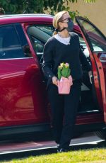 FELICITY HUFFMAN Arrives at a Friend