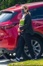 FELICITY HUFFMAN Arrives at a Friend