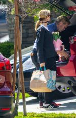 FELICITY HUFFMAN Arrives at a Friend