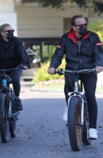 HEATHER MILLIGAN and Arnold Schwarzenegger Out Riding Bikes in Santa Monica 03/13/2021