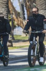HEATHER MILLIGAN and Arnold Schwarzenegger Out Riding Bikes in Santa Monica 03/13/2021