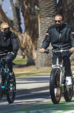 HEATHER MILLIGAN and Arnold Schwarzenegger Out Riding Bikes in Santa Monica 03/13/2021