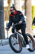 HEATHER MILLIGAN and Arnold Schwarzenegger Out Riding Bikes in Santa Monica 03/13/2021