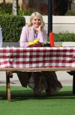 HOLLY WILLOGHBY on the Set of This Morning 03/29/2021 