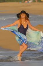 JANE SEYMOUR in a Blac Swimsuit at a Beach in Hawaii 03/11/2021