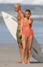 LARA BINGLE in Bikinis at a Photoshoot on the Beach in Sydney 03/04/2021
