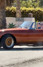 LAUREN SILVERMAN and Simon Cowell Out Driving in Vintage MG Turbo in Malibu 03/17/2021
