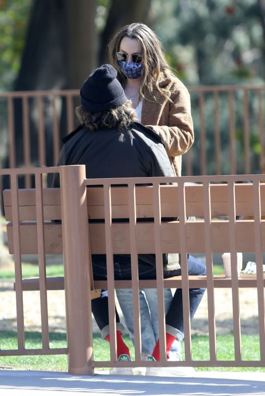 LEIGHTON MEESTER and Adam Brody at a Park in Los Angeles 03/15/2021