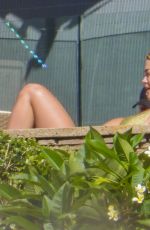 RITA ORA in Bikini Sunbathes at Her Sydney Home 02/27/2021