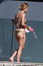 RITA ORA in Bikini Sunbathes at Her Sydney Home 02/27/2021