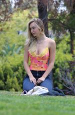 ALEXIS REN Playing with Her Dog at a Park in Los Angeles 04/27/2021