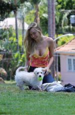 ALEXIS REN Playing with Her Dog at a Park in Los Angeles 04/27/2021