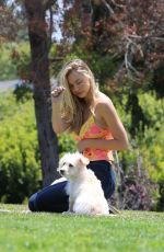 ALEXIS REN Playing with Her Dog at a Park in Los Angeles 04/27/2021