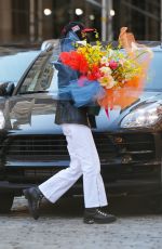 BELLA HADID with a Huge Bouquet of Flowers Out in New York 04/23/2021