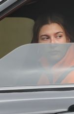 HAILEY BIEBER Out Driving in Los Angeles 04/12/2021