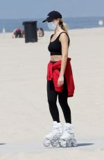 MARGOT ROBBIE Out Rollerblading at a Beach in Malibu 04/18/2021