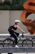 RITA ORA Out Riding a Bike at Harbour in Sydney 04/14/2021