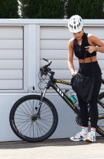 RITA ORA Out Riding a Bike at Harbour in Sydney 04/14/2021