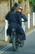ROSIE HUNTINGTON-WHITELEY and Jason Statham Rides Electric Bike Out in London 03/24/2021