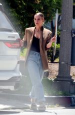 ASHLEE SIMPSON Picks up a For Sale Sign from Her Old House in Sherman Oaks 05/25/2021