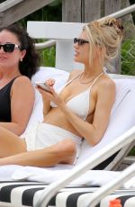 CHARLOTTE MCKINNEY in a White Bikini at a Beach in Miami 05/14/2021