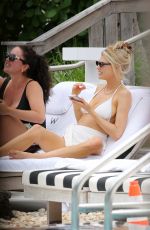 CHARLOTTE MCKINNEY in a White Bikini at a Beach in Miami 05/14/2021