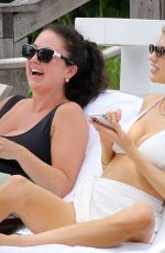 CHARLOTTE MCKINNEY in a White Bikini at a Beach in Miami 05/14/2021