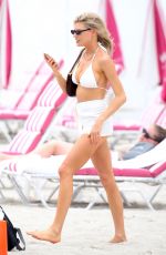 CHARLOTTE MCKINNEY in a White Bikini at a Beach in Miami 05/14/2021